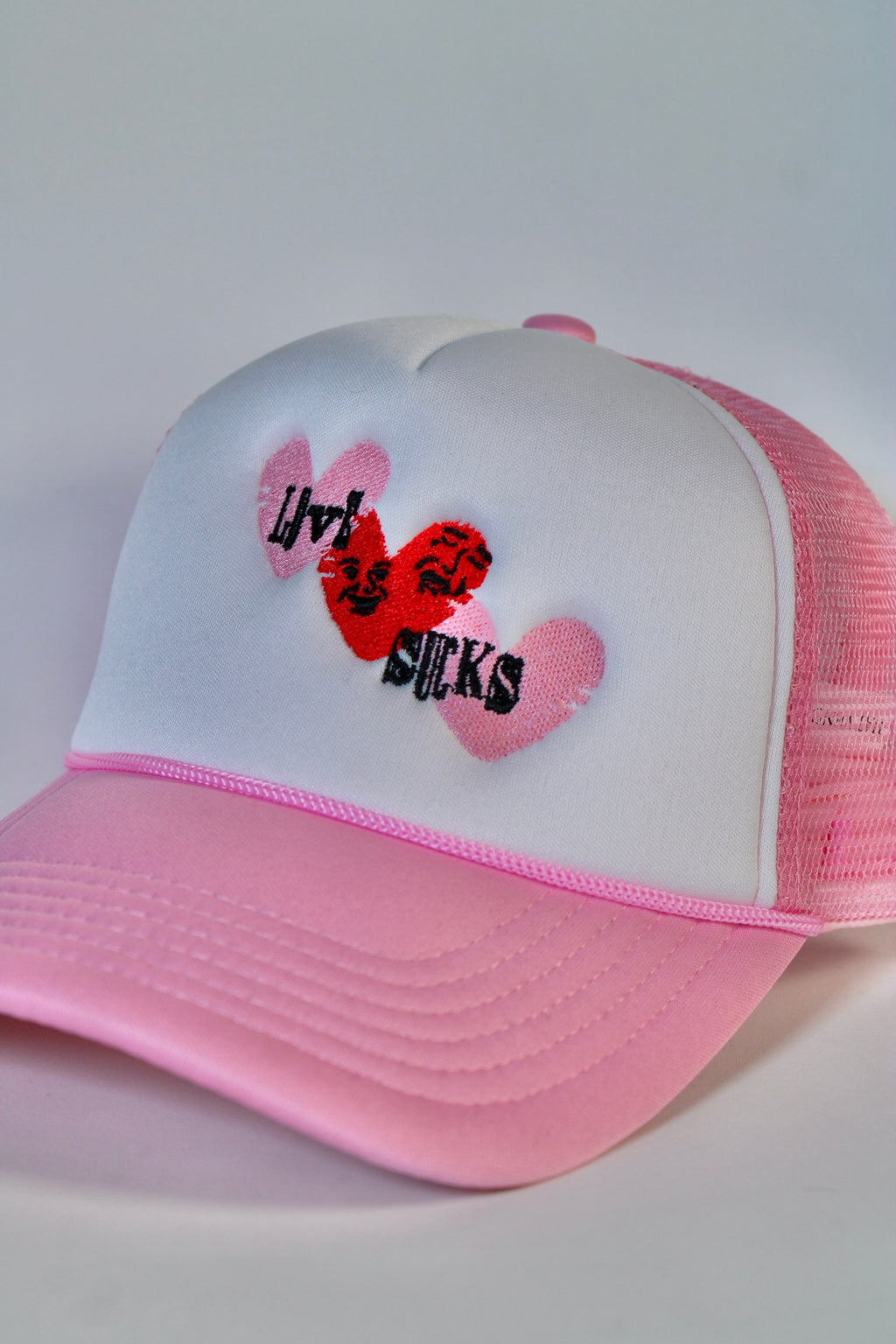 Love Sucks Trucker Hat